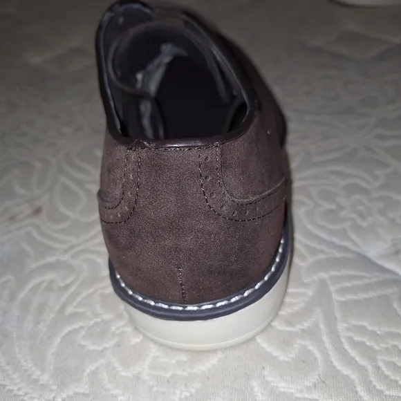 A pair of Franco Vanucci brown suede men's loafers in a size 10.5. EUC.