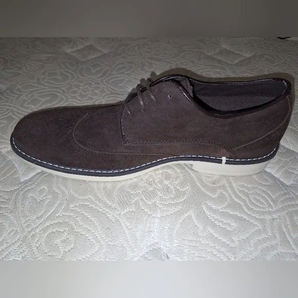 A pair of Franco Vanucci brown suede men's loafers in a size 10.5. EUC.