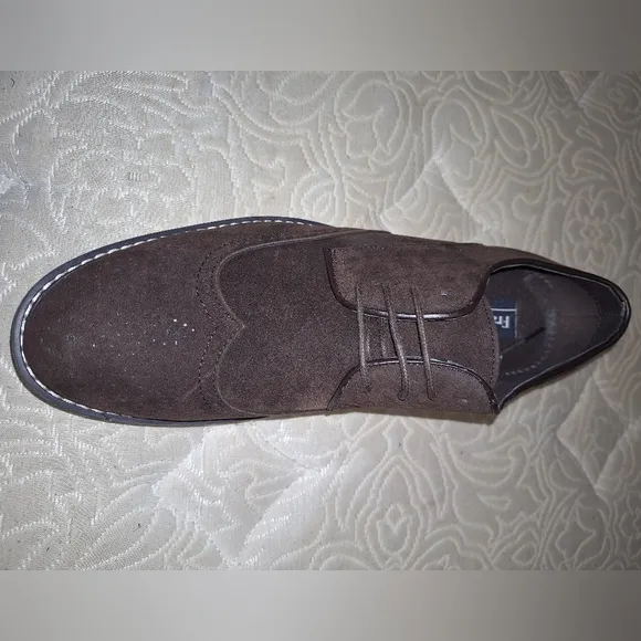 A pair of Franco Vanucci brown suede men's loafers in a size 10.5. EUC.