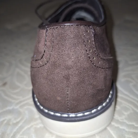 A pair of Franco Vanucci brown suede men's loafers in a size 10.5. EUC.