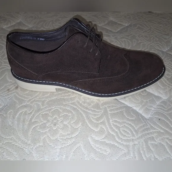 A pair of Franco Vanucci brown suede men's loafers in a size 10.5. EUC.