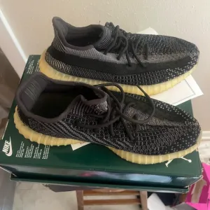 Adidas Black and Gray Sneakers with Textured Knit Upper