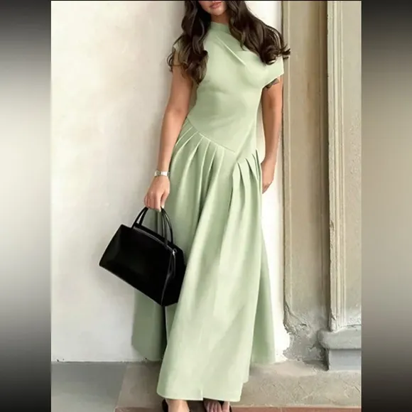 Asymmetrical sleeve mint green pleated midi drop waist dress, stretchy material