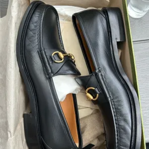 Gucci Black and Gold Horsebit Loafers Sleek Slip-Ons