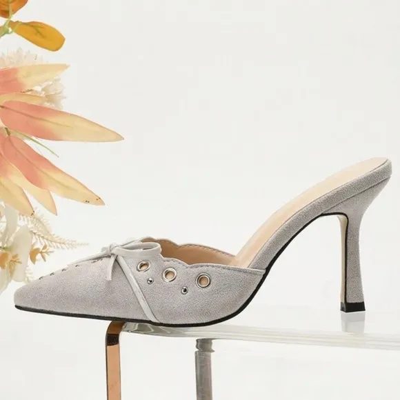 Light pale gray studded detail bow front faux suede mule heels