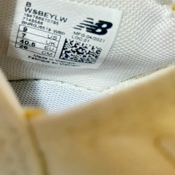 New Balance White and Gold Sneakers