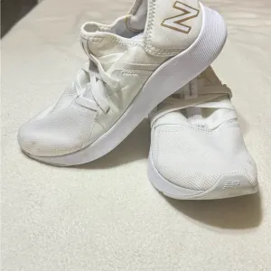 New Balance White and Gold Sneakers