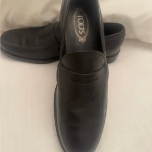 Tod's Black Leather Slip-On Loafers